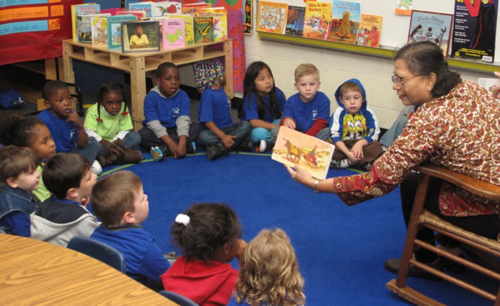 Woman reading to pre-k class